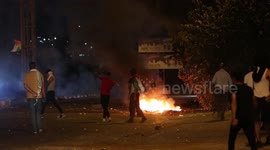 Palestinian youths clash with Israeli forces near the Hawara checkpoint