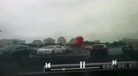 Falling crane crushes car trapping driver inside in China