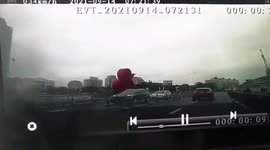 Falling crane crushes car trapping driver inside in China