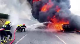 Truck carrying oil ignites after colliding with vehicle on highway in northern China