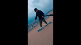 Man enjoys his adventures while sandboarding in Chile every day of the year