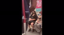 ''Awkward train ride' man caught leaning on pole with his butt
'