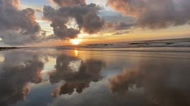 Watch this stunning sunrise with incredible beach reflections from Isle of Palms, South Carolina