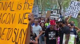 Anti-vax protesters hold a demonstration in Bryant Park in NYC, US