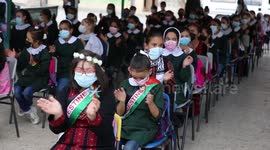 Palestinian female student Farah Isleem, who was wounded during the recent conflict between Hamas and Israel backs to her school after a treatment trip in Jordan