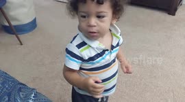 Curly haired baby boy cries when mommy tells him he can't watch TV