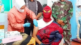 Indonesian school principal wears Spiderman costume when injected with Covid-19 vaccine to motivate students and teachers