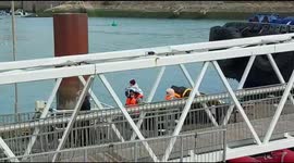 Migrant baby arrives safely on adult's shoulders after being picked up in English channel