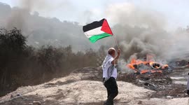 Palestinian protesters clash with Israeli security forces following a demonstration against settlements in the West Bank village of Beita