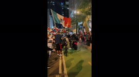 Guy and girl do motorcycle burnouts in celebration of Mexican Independence Day in downtown Chicago