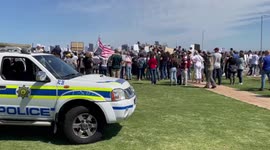 South African police observe as anti-vaccers break lockdown regulations