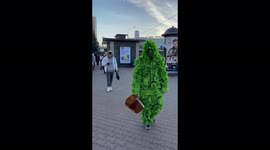 A man in a tree suit scares people on the streets of Minsk, Belarus