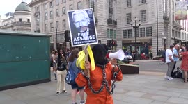 'Free Julian Assange' protest at Piccadilly Circus demands to stop his extradition to the US