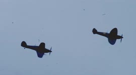 Spitfire and Hurricane aircraft fly over London after Battle of Britain Memorial service at Westminster Abbey