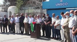 Palestinians attend a press conference, in front of the UNESCO headquarters