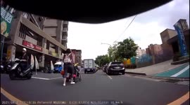 CLOSE CALL: Mother Pushes Her Baby In The Way of Moped Rider When Crossing Road