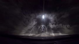 Dashcam - first snow - driving through tunnel and up mountain pass road Switzerland