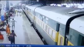 Woman & minor daughter narrow escape after they fell between a platform on a moving train while alighting from it in Northern India.