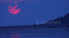 Spectacular September Harvest moon rises over sea in Kent, UK