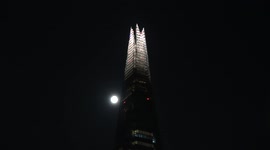 Harvest Moon rises by London Shard