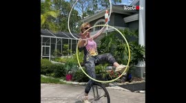 'Extremely talented hula hoop artist puts her multitasking skills to the test'