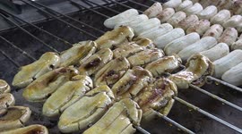 Street food: Watch these delicious Thai grilled bananas covered in syrup being made