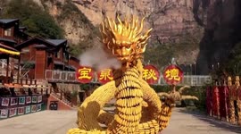 Chinese tourist attraction uses over 50,000 pieces of corn to form giant golden dragon statue