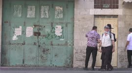 Israeli forces stand guard as groups of Israeli Ultra Orthodox Jews on their way to visit the tomb of Othniel Ben Kenaz