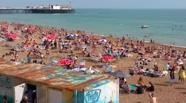 UK hottest day Brighton very crowded beach