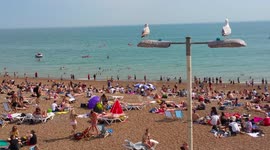 UK hottest day Brighton crowded beach front