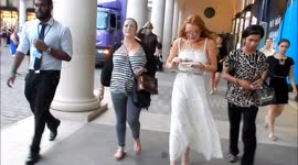 Lindsay Lohan eats ice cream as she leaves launch