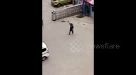 Man shoots police officer in western China ++Warning: Graphic++
