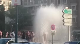 Dancing in water hydrant spray in Paris heatwave