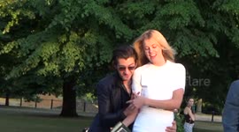 Alex Turner stumbles into girlfriend at Serpentine party