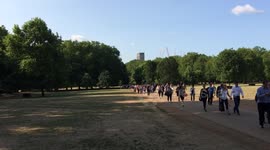 Tube strike commuters walk through Green Park