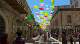 Umbrella Project decorating Nahalat Shiv'a neighborhood in Jerusalem