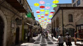 Umbrella Project decorating Nahalat Shiv'a neighborhood in Jerusalem