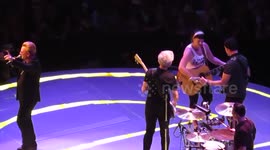 Fan gets to play guitar on stage with U2