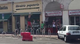 Men use bike racks to work out on the streets of Nice, France