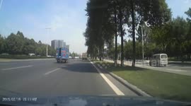 Gas canister falls off back of truck in China