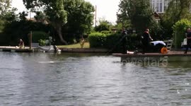 Dive team scour the bed of the Thames for swimmer feared drowned
