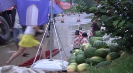 Truck spills watermelons across China road after crash