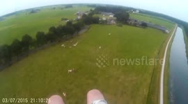 Paraglider lands in cow field after running out of fuel
