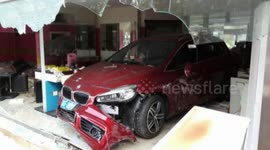 Woman smashes car into salon while reversing in China