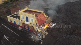 Drone footage - La Palma Volcano 22/09/2021. Lava devouring a restaurante. Drone really close to the lava.