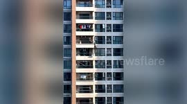 Chinese police officer climbs down high-rise building to rescue 4-year-old hanging from 10th-floor balcony