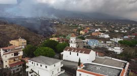 Drone footage - La Palma Volcano 21/09/2021. From a church, surrrounding the lava trail.