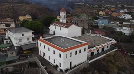 Drone footage - La Palma Volcano 21/09/2021. Lava trail getting to the town shooted from the church
