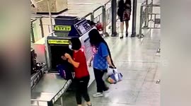 Train station staff rolled into security scanner after falling onto conveyor belt in central China