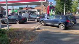 Long queues at some UK petrol stations as drivers defy appeals not to panic buy
